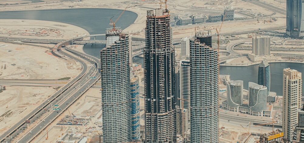 a large group of tall buildings under construction